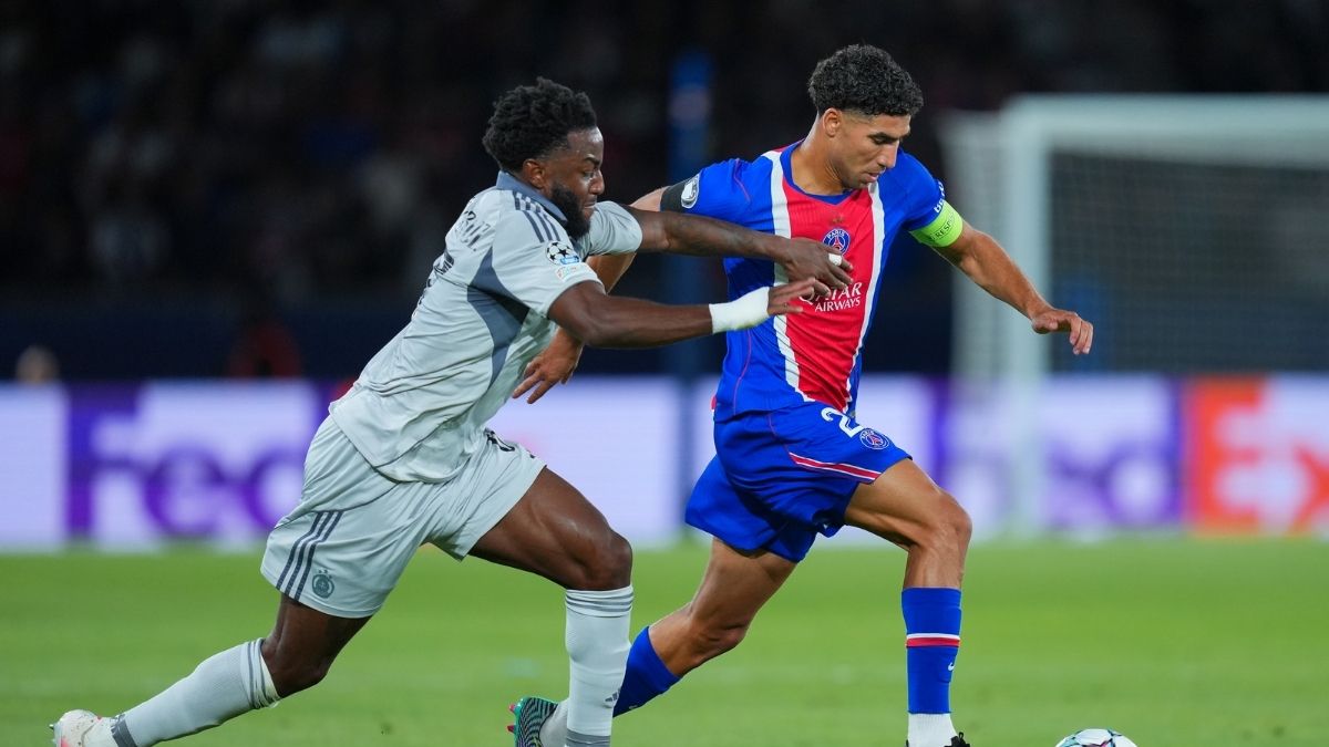 Achraf Hakimi runs with the ball. (Photo by Alexander Hassenstein/Getty Images)